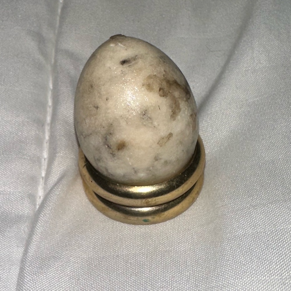 Quartz egg on stand